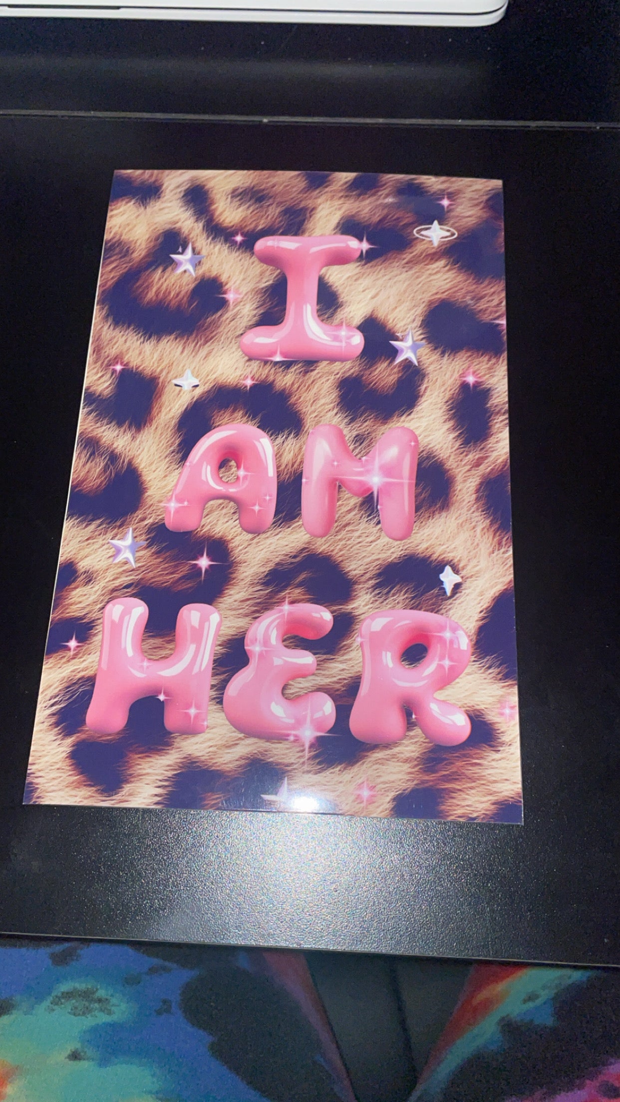 Leopard print card with pink text 'I AM HER' on a black border.