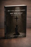 Bible study journal with a dark cover featuring a silhouette of a person praying and a cross.