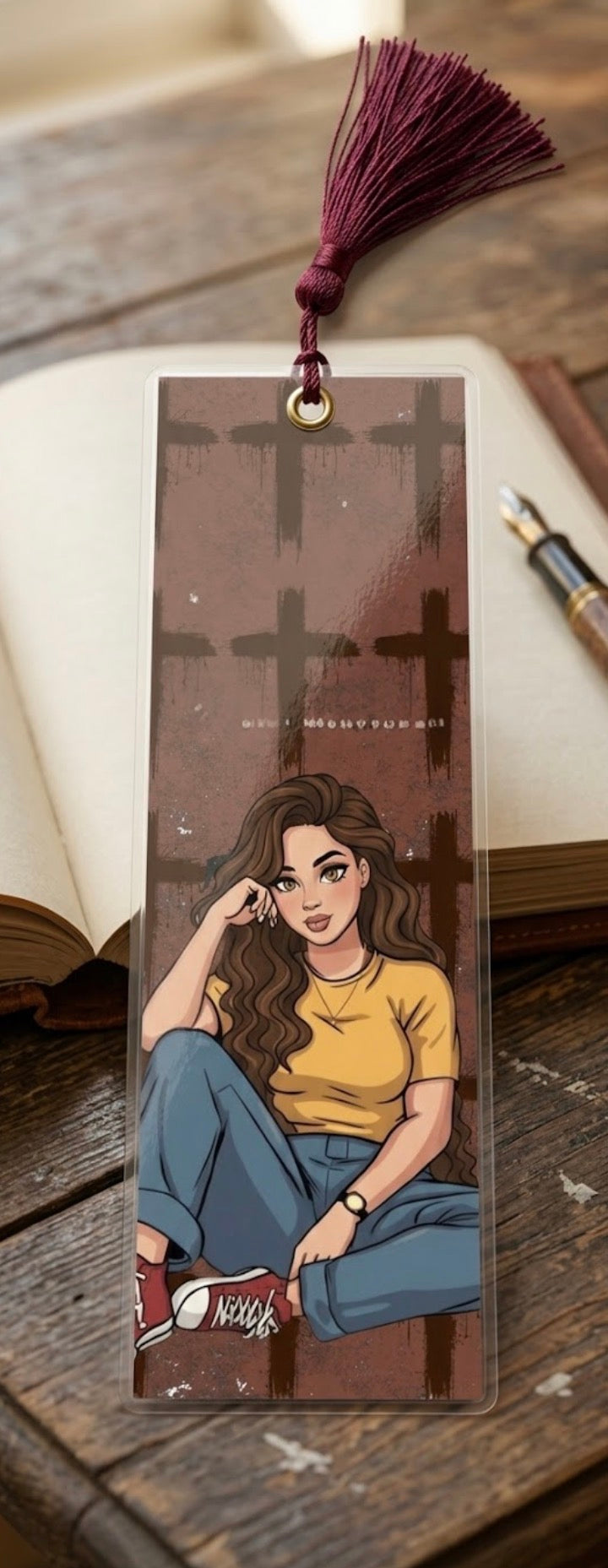 Bookmark with an illustration of a person sitting, on a wooden surface.