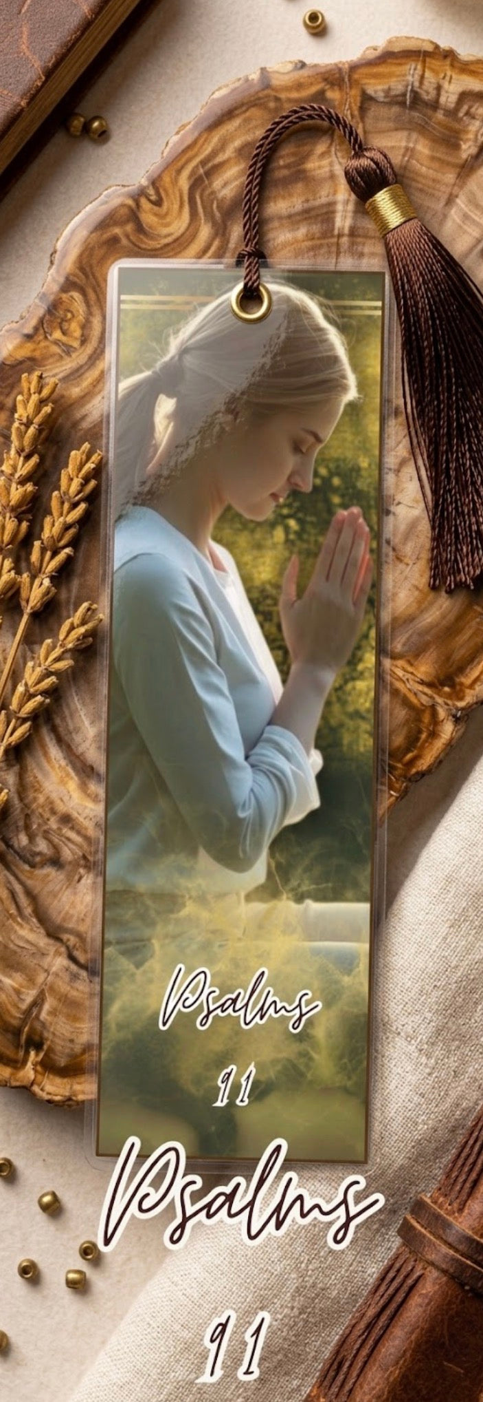 Bookmark with a religious design featuring a praying figure, tassel, and text 'Psalms 11'.
