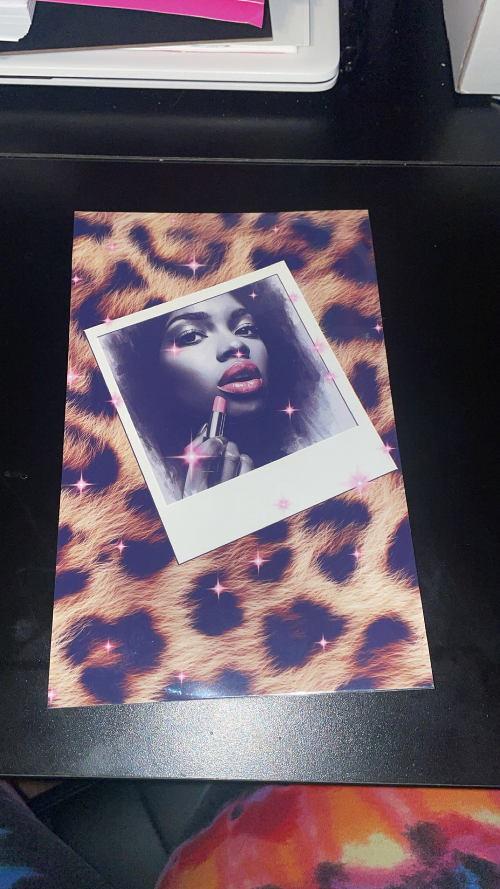 Polaroid photo of a woman with makeup on a leopard print background