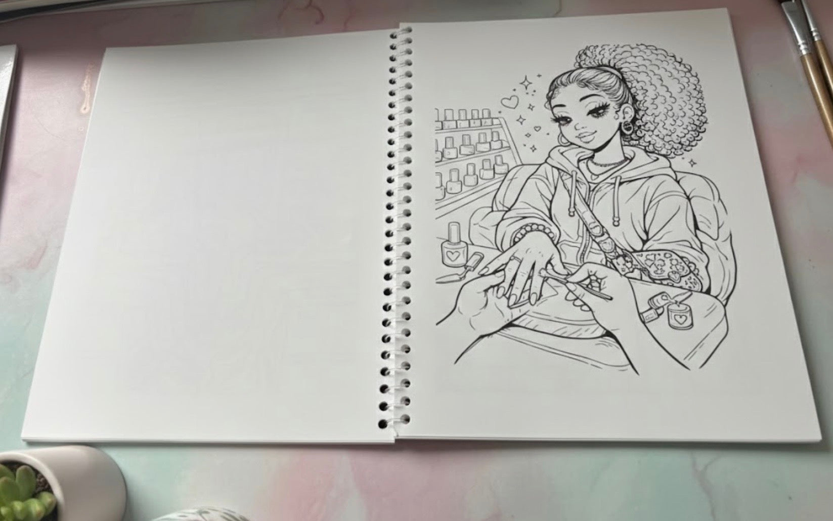 Line drawing of a person getting a manicure on a notebook with a pink background