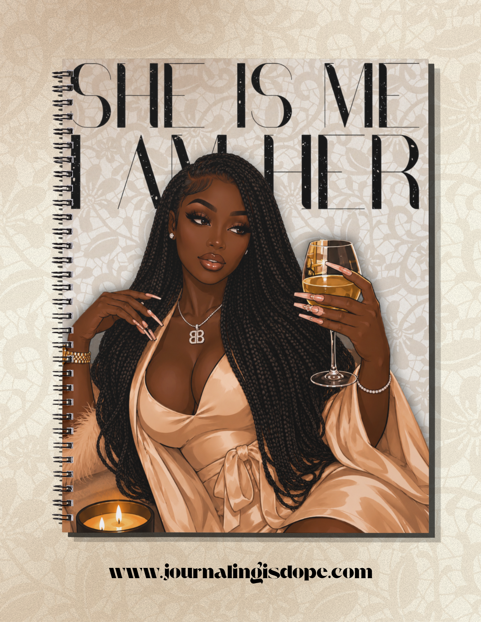 Notebook cover with an illustration of a woman holding a glass of wine, text 'SHE IS ME ANOTHER', and a website URL.
