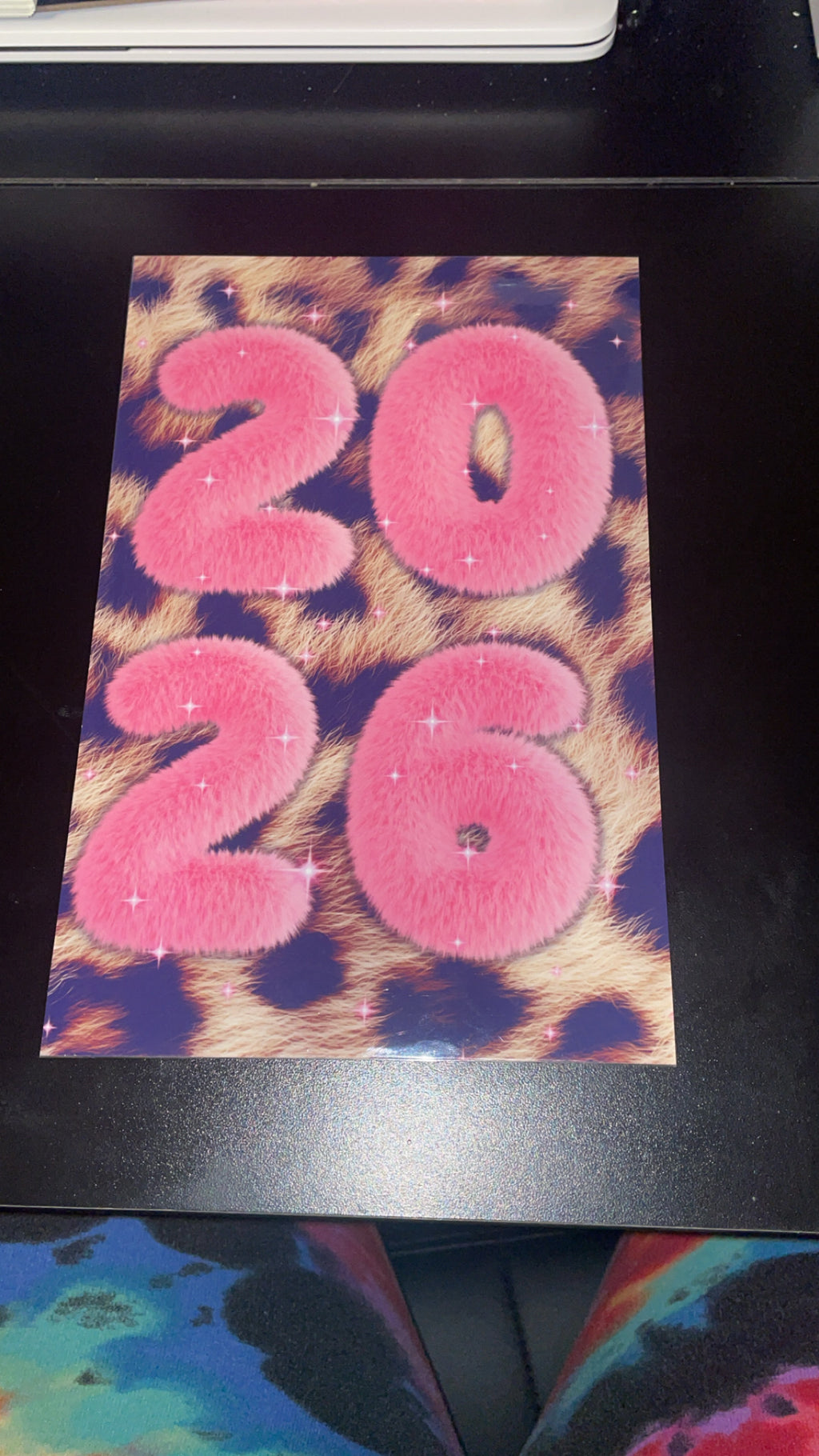 Card with '2026' in pink on a leopard print background