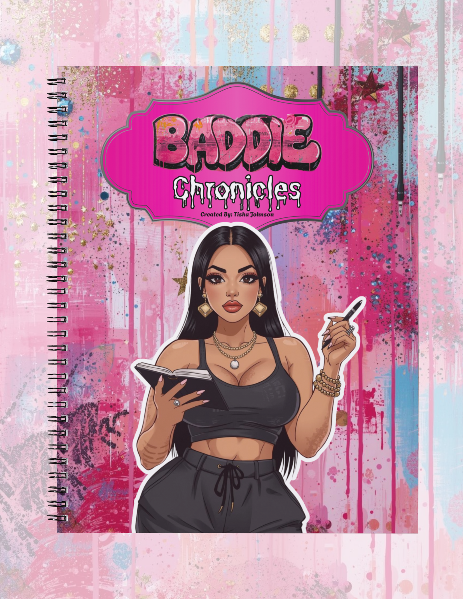 Notebook titled 'Baddie Chronicles' with a stylized cover design on a pink and blue splatter background.