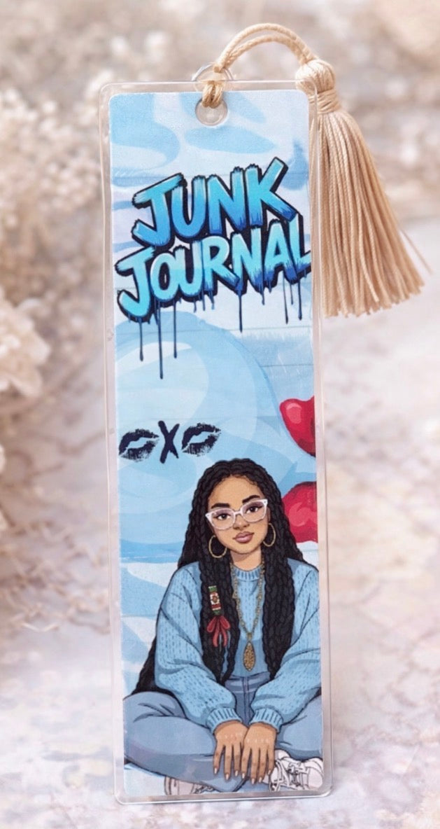 Bookmark with illustration of a woman, text 'Junk Journal', and tassel on a light background